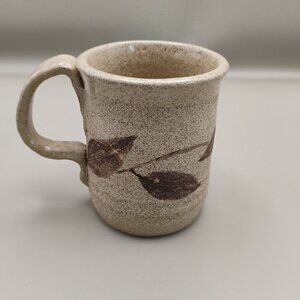 handcrafted pottery ceramic mug tan with dark brown leaves vine design w ladybug